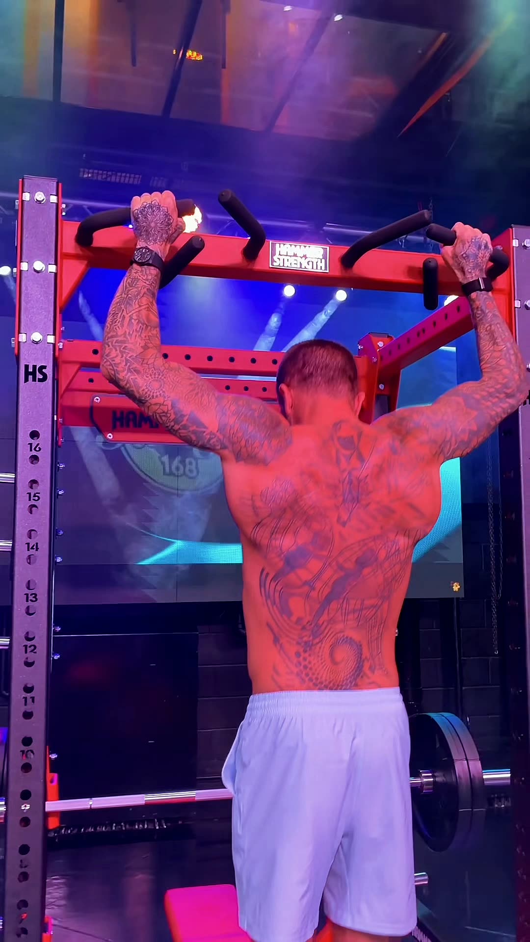 Pull-ups against a blue-lit LED panel at Wabash Iron
